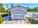 Exterior home shot with a garage, showcasing practical space and potential for renovation and personalization at 4610 47Th N Way, St Petersburg, FL 33702