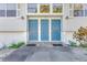 Welcoming front entrance featuring stylish blue doors, enhancing curb appeal and creating a lasting first impression at 4610 47Th N Way, St Petersburg, FL 33702