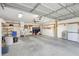 The spacious garage offers storage and ample room for parking, with convenient shelving at 4610 47Th N Way, St Petersburg, FL 33702