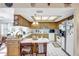 Well-lit kitchen with white appliances, tile flooring, and ample cabinet space at 4610 47Th N Way, St Petersburg, FL 33702