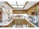Bright kitchen with stainless steel appliances, sleek countertops, and skylight at 4610 47Th N Way, St Petersburg, FL 33702