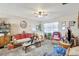 Living room space featuring a ceiling fan and plenty of decor at 4610 47Th N Way, St Petersburg, FL 33702