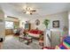 Cozy living room connected to an eat-in kitchen and features lots of floral decor at 4610 47Th N Way, St Petersburg, FL 33702