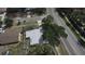Overhead view of a building and its surroundings, showcasing a paved street and some trees at 4735 W Wisconsin Ave, Tampa, FL 33616