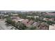 A scenic aerial view of houses with vibrant rooftops and greenery, plus proximity to the street at 4735 W Wisconsin Ave, Tampa, FL 33616