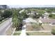 Aerial view of a well-maintained home featuring mature trees and landscaping in a suburban neighborhood at 4735 W Wisconsin Ave, Tampa, FL 33616
