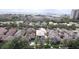 Neighborhood aerial featuring rooftops, mature trees, landscaping, a community pool and waterfront location at 4735 W Wisconsin Ave, Tampa, FL 33616