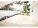 Large fenced backyard with a concrete slab perfect for outdoor entertaining or relaxation at 4735 W Wisconsin Ave, Tampa, FL 33616