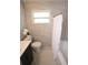 Elegant bathroom featuring marble-like tiles, a modern vanity, and a bathtub with a shower curtain at 4735 W Wisconsin Ave, Tampa, FL 33616