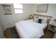 Bright bedroom with hardwood floors, comfy bed, and stylish side tables at 4735 W Wisconsin Ave, Tampa, FL 33616