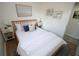 Well-lit bedroom featuring a comfortable bed and neutral decor at 4735 W Wisconsin Ave, Tampa, FL 33616