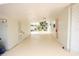 The covered carport provides ample parking and direct access to the home's pink front door at 4735 W Wisconsin Ave, Tampa, FL 33616