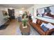 Open-concept living space with updated kitchen, seating, and hardwood floors at 4735 W Wisconsin Ave, Tampa, FL 33616