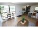 Stylish living area featuring modern furnishings, wood floors, and large window at 4735 W Wisconsin Ave, Tampa, FL 33616