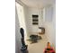 Bright utility room with storage cabinet, decorative wall hanging, tools and accessories at 4735 W Wisconsin Ave, Tampa, FL 33616
