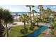 Beautiful waterfront grounds, featuring lush lawns, palm trees, and a glimpse of the sandy beach at 5500 Gulf Blvd # 2249, St Pete Beach, FL 33706