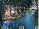 Relaxing view from the property overlooking a scenic waterway with people enjoying paddle boats at 5500 Gulf Blvd # 2249, St Pete Beach, FL 33706