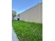 Exterior view of backyard area with privacy fence and green space at 600 3Rd S Ave # 503, St Petersburg, FL 33701