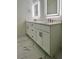 Modern bathroom featuring double vanity, sleek fixtures, and marbled tile flooring at 600 3Rd S Ave # 503, St Petersburg, FL 33701