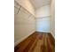 Empty walk-in closet with hardwood floors and shelving at 600 3Rd S Ave # 503, St Petersburg, FL 33701