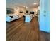 Open-concept living room with hardwood floors, modern furnishings, and lots of natural light at 600 3Rd S Ave # 503, St Petersburg, FL 33701