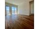 Bright living room with hardwood flooring and access to a balcony at 600 3Rd S Ave # 503, St Petersburg, FL 33701