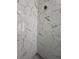 Shower featuring white marble style tiles with dark veining at 600 3Rd S Ave # 503, St Petersburg, FL 33701