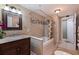 Elegant bathroom featuring tiled shower, stylish vanity, and modern fixtures at 6219 57Th N Ave, St Petersburg, FL 33709