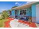 Charming home featuring a cozy front porch, manicured landscaping, and welcoming curb appeal at 6219 57Th N Ave, St Petersburg, FL 33709