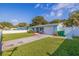 Inviting single-story home with well-maintained lawn, paved driveway, and attached garage at 6219 57Th N Ave, St Petersburg, FL 33709