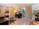 Inviting living room with tile floors, neutral walls, and adjacent bedroom and bathroom at 6219 57Th N Ave, St Petersburg, FL 33709