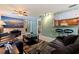 Open living room with tile floors and a partial view of the kitchen and breakfast bar at 6219 57Th N Ave, St Petersburg, FL 33709