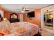 Comfortable main bedroom with tile flooring, stylish dresser, and TV at 6219 57Th N Ave, St Petersburg, FL 33709