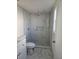 Bathroom with gray and white tile and a recessed shower niche at 6241 Westport Dr, Port Richey, FL 34668