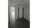 Bedroom featuring access to the bathroom and a closet with louvered doors at 6241 Westport Dr, Port Richey, FL 34668
