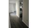 Hallway with new flooring leading to various rooms in the home at 6241 Westport Dr, Port Richey, FL 34668