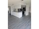 Kitchen with granite countertop pass-through and stainless steel appliances at 6241 Westport Dr, Port Richey, FL 34668