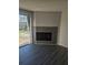 Living room with a fireplace and sliding glass doors to the outside patio at 6241 Westport Dr, Port Richey, FL 34668