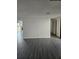 Open living area featuring new flooring and easy access to other rooms at 6241 Westport Dr, Port Richey, FL 34668