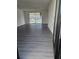 Bright living room features sliding glass doors to a screened-in patio at 6241 Westport Dr, Port Richey, FL 34668