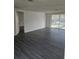 Open floor plan and access to outdoor space via sliding glass doors at 6241 Westport Dr, Port Richey, FL 34668