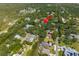 An aerial view highlights the home's location amidst a lush, green landscape with waterfront access, marked by a red arrow at 7417 Seagull Way, Tampa, FL 33635
