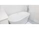 Bright bathroom with tile floors, a new soaking tub and modern fixtures at 7417 Seagull Way, Tampa, FL 33635