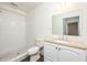 Clean, bright bathroom features a walk-in shower, granite countertops, and modern fixtures, creating a functional design at 7417 Seagull Way, Tampa, FL 33635
