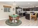 Eat-in kitchen featuring stainless steel appliances, dark wood cabinets, and laminate flooring at 7417 Seagull Way, Tampa, FL 33635