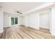 Inviting living room with new floors, ceiling fan, and sliding glass doors, creating a bright and airy space at 7417 Seagull Way, Tampa, FL 33635