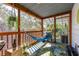 Comfortable screened porch with cozy hammock, plants, and natural light, offering a relaxing outdoor space at 7417 Seagull Way, Tampa, FL 33635