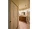 Well-lit bathroom showcasing a vanity with granite countertop and tiled floor at 7828 Hardwick # 923, New Port Richey, FL 34655