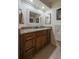 Bathroom vanity with granite countertops and sleek, wood cabinetry at 7828 Hardwick # 923, New Port Richey, FL 34655