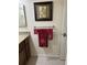 Bathroom with granite countertops, a stylish towel rack, and tasteful wall decor at 7828 Hardwick # 923, New Port Richey, FL 34655